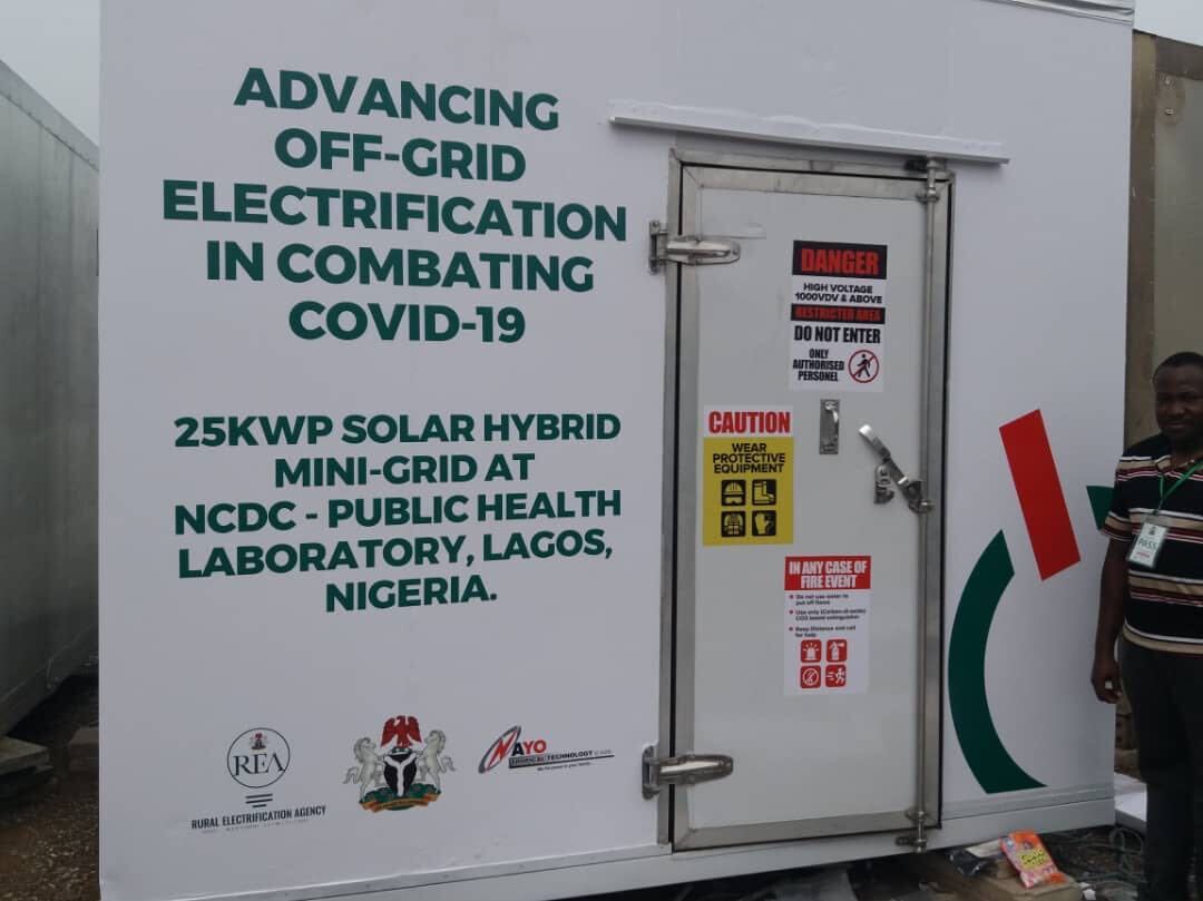 Electricity unit with text printed saying: Advancing off-grid electrification in combating covid-19