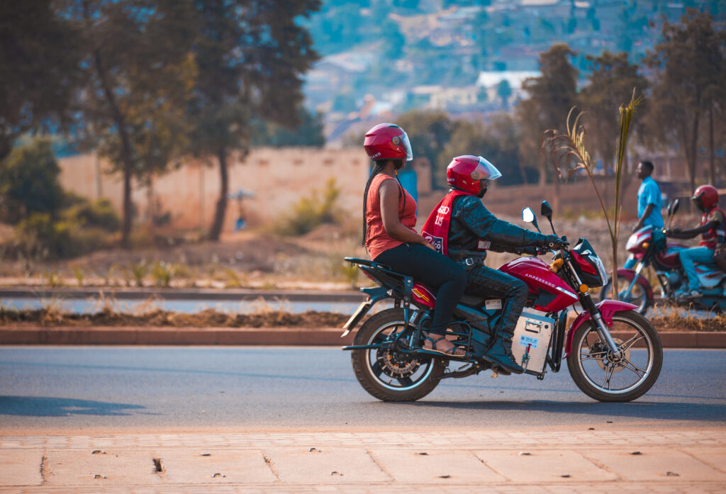 Driver and passenger on an electric motorcylce