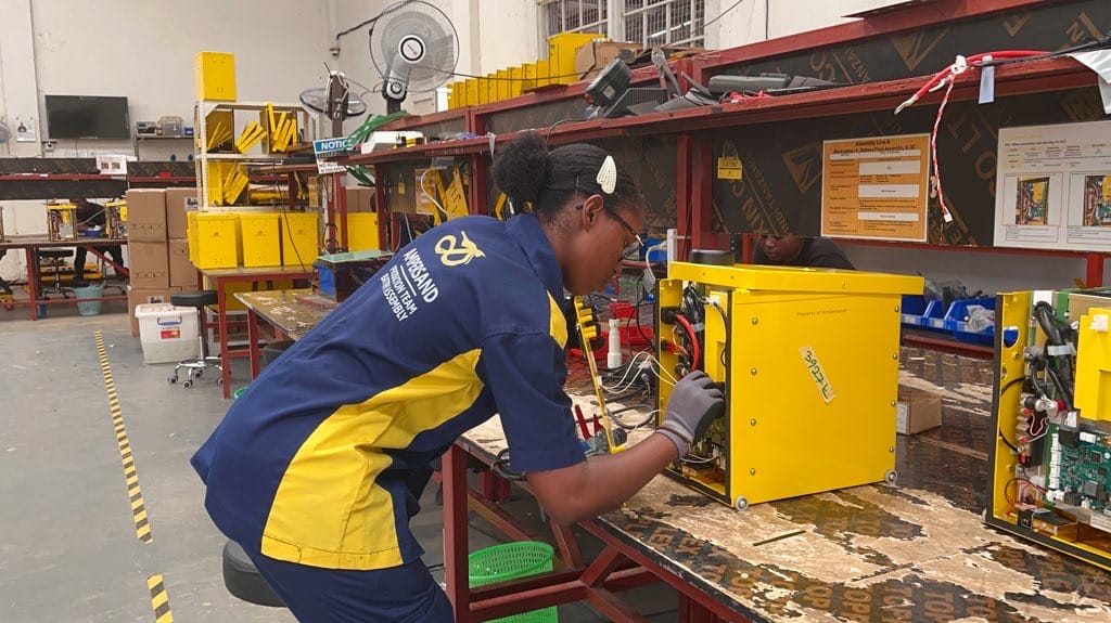 Female employee working on a battery