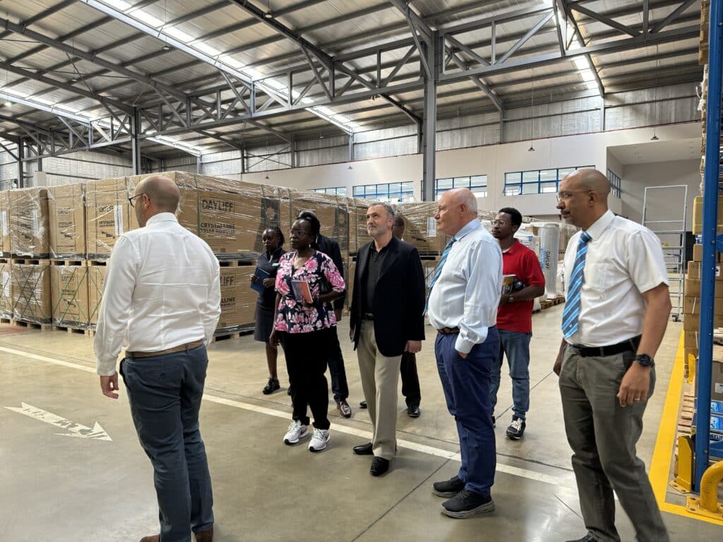 Group of people talking in a warehouse