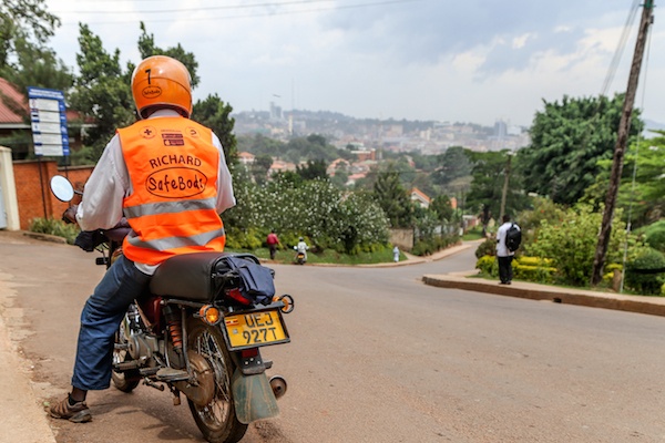 man on SafeBoda bike fro rear